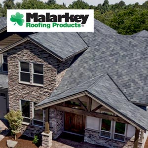 House with gray Malarkey shingles and the Malarkey Roofing Products logo on the top left